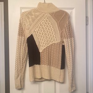 Size small knit sweater- black, cream, and tan. Perfect condition.